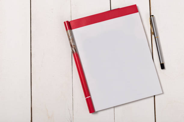 istock Mock-up magazine or catalog on wooden table. Blank page or notepad on wood background. Blank page or notepad for mockups or simulations 1139606649