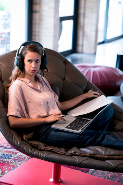 istock Woman working with laptop from the couch 1139606732