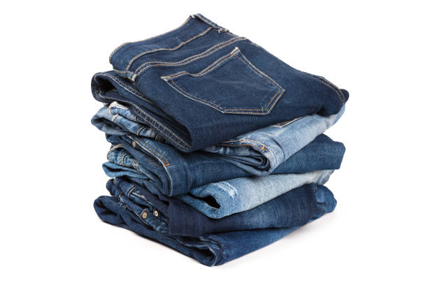 istock A stack of clothes jeans pants on a white background. Isolation 1139606819