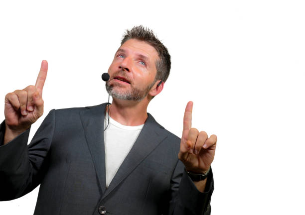 istock young attractive and confident successful man with headset speaking at corporate business coaching and training auditorium conference room talking giving motivation training isolated on white 1139608047