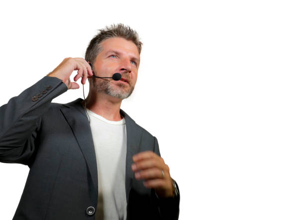 istock young attractive and confident successful man with headset speaking at corporate business coaching and training auditorium conference room talking giving motivation training isolated on white 1139608063