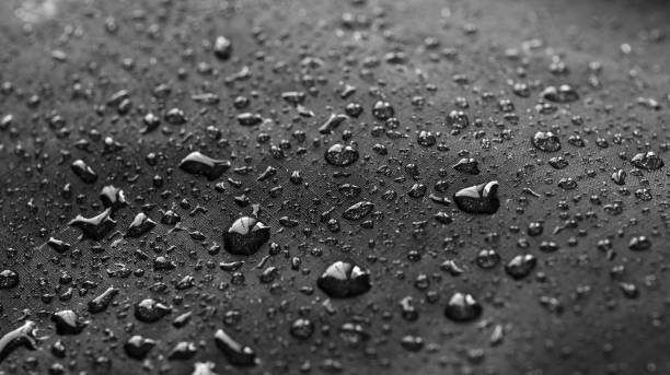 istock Rain Water droplets on black waterproof fabric 1139608963
