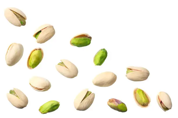 Photo of pistachio isolated on the white background. top view