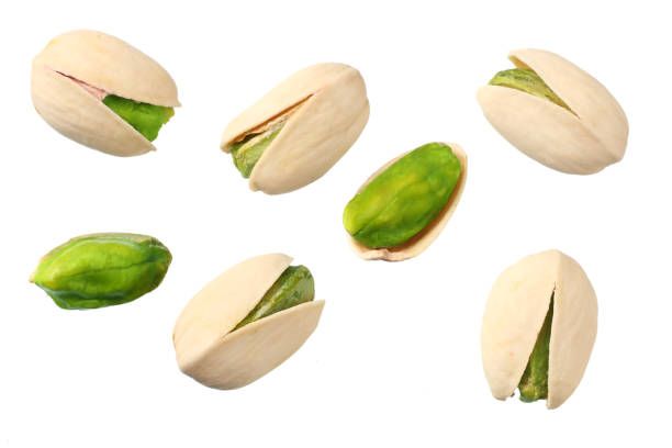 istock pistachio isolated on the white background. top view 1139610100
