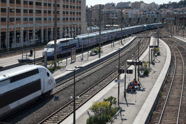 Nice, France - March 26 2019: TGV entering Nice-Ville railway station while another one is already at the platform.