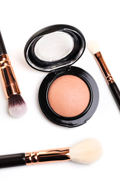 istock eye shadow, blush, powder, sculptor in a pack with make up brushes on a white background. Isolated on white. - Image 1139612362