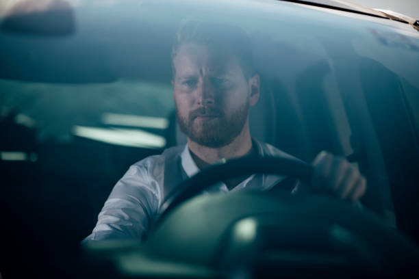 istock Businessman driving car 1139615572