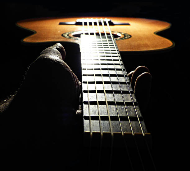 istock Hand holding neck of the guitar 1139617079