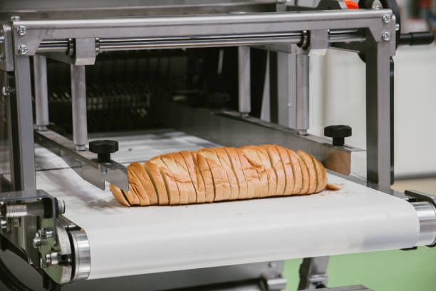 istock sliced white bread in cutting machine, baking equipment selective focus 1139618554