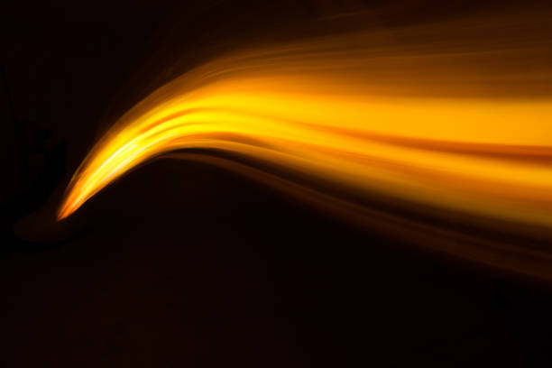 istock Glowing shiny curve light trail lines effect in black background. 1139619911