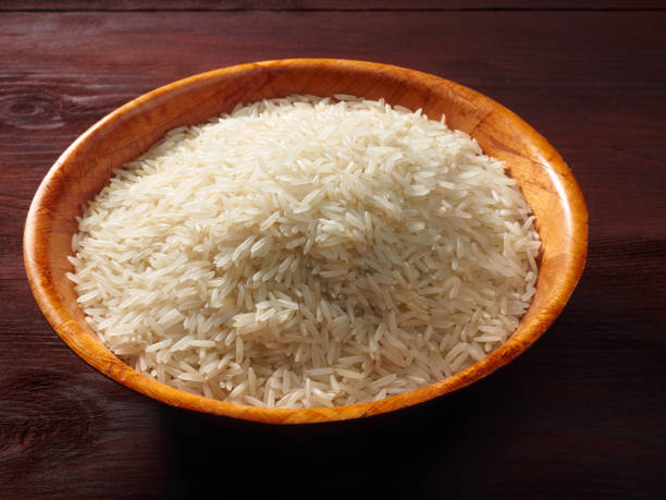 istock White basmati rice in a bamboo bowl on a brown wooden background 1139620093