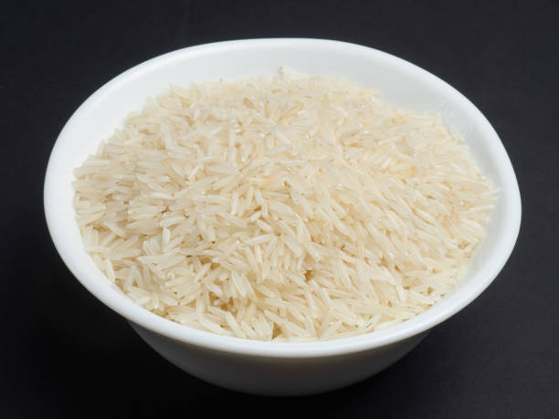 istock White basmati rice in a white bowl on a black background 1139620152