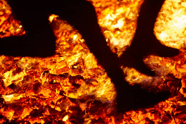 istock Summer solstice celebration jumping into the fire. Burning flames 1139622707