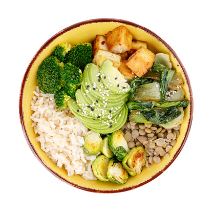 Buddha bowls isolated on white background. Colorful bowls with vegetables, healthy grains, and protein. Rice, lentils, tofu, avocado, broccoli, brussels sprouts, bok choy, sesame seeds. Healthy vegan food, vegetarian food concept. Top view.