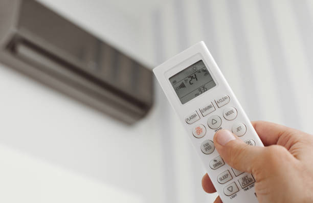 istock Adjusting air conditioning at home 1139625795
