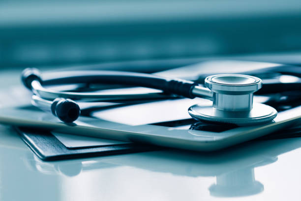 istock Close up of white tablet and stethoscope on table 1139629235