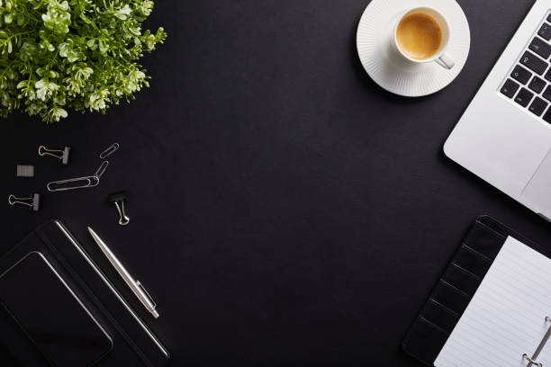 Top view of workplace with coffee cup and laptop
