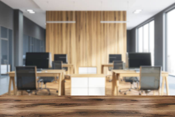 istock Gray and wooden open space office blur 1139630650