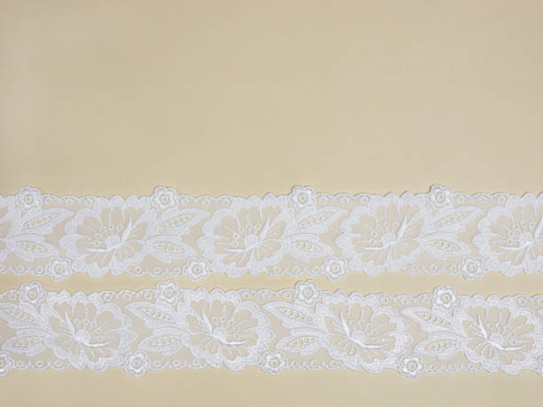 istock White lace on a beige background 1139633545