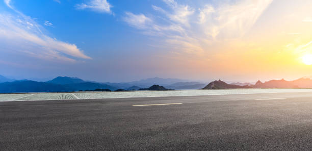 istock Asphalt road and beautiful mountain with great wall in China 1139635232