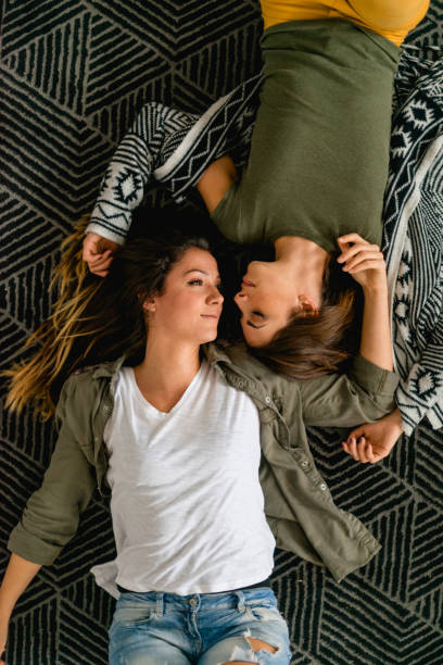 istock Lesbian couple lying on the floor 1139635953