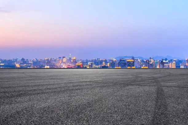 Photo of Asphalt race track ground and beautiful city scenery in Hangzhou