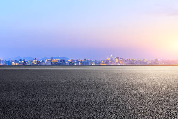 Empty asphalt road and city skyline in hangzhou