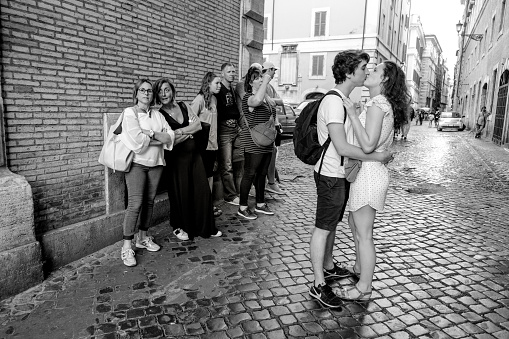 Rome, Italy, May 20 - A couple of tourists take a romantic moment in the alleys of the eternal city, near the famous Piazza Navona, in the heart of the historic center of Rome.