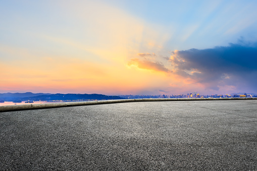 Asphalt race track ground and beautiful city scenery in Hangzhou at night