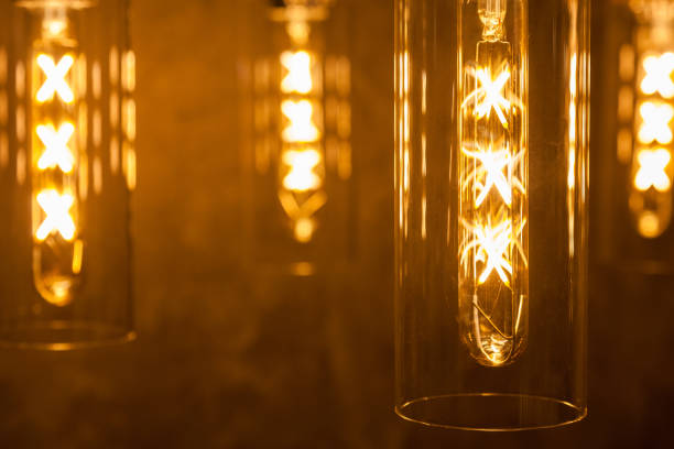 istock collection of modern glowing bulbs hanging near wall 1139639914