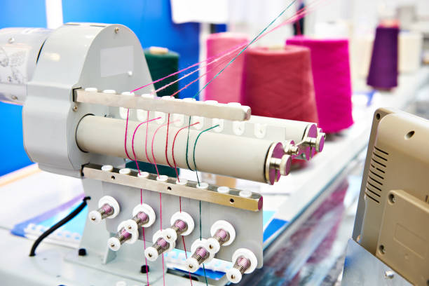 istock Industrial sewing machine in textile factory 1139642173