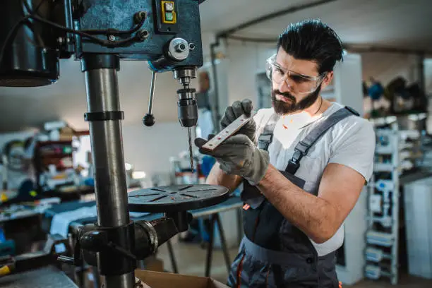 Industrial engineer at the lathe machine