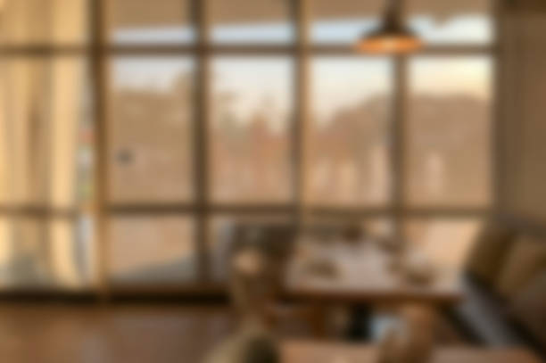 istock blurred modern  coffee cafe background, window interior table chairs, dinning room 1139642785