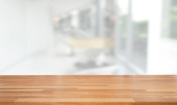 istock Empty wooden table and blurred modern white abstract background, Ready for product montage, indoor and window 1139643343