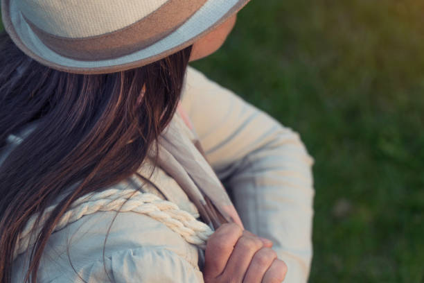 pretty fashionable woman enjoying the sunset, fashion girl, one young woman tourist enjoying the sunrise light, portrait, back lit, travel, exploration, adventure, outdoors, springtime, - back lit women one person spring imagens e fotografias de stock