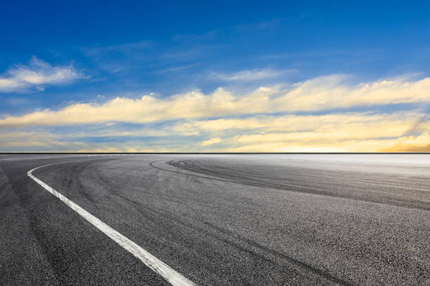 istock Asphalt race track ground and beautiful sky clouds at sunset 1139649335