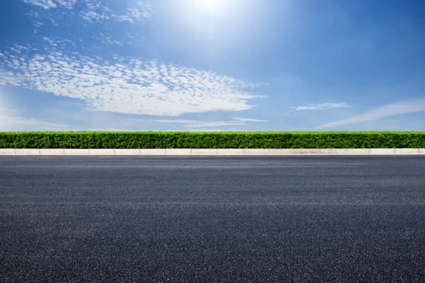 istock Empty asphalt road and blue sky with white clouds 1139650333