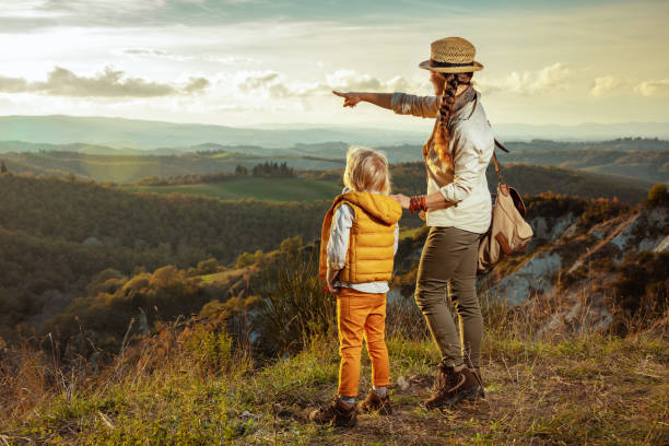 istock modern mother and child hikers pointing at something 1139650466