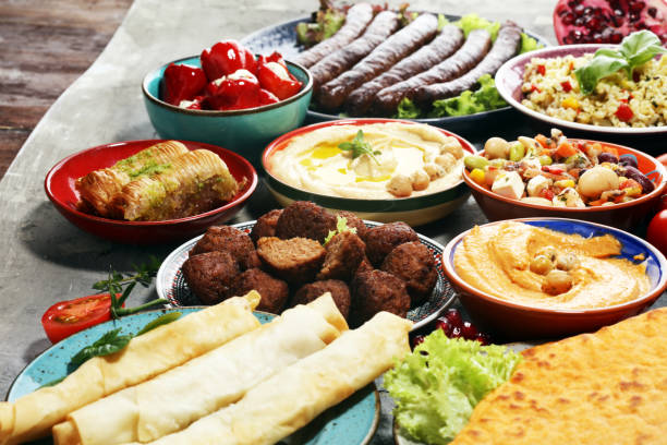 istock Middle eastern or arabic dishes and assorted meze, concrete rustic background. Falafel. Turkish Dessert Baklava with pistachio. Halal food. Lebanese cuisine 1139651037
