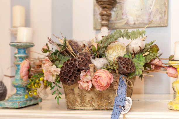 istock decorative artificial flowers in a basket and an antique candlestick 1139651417
