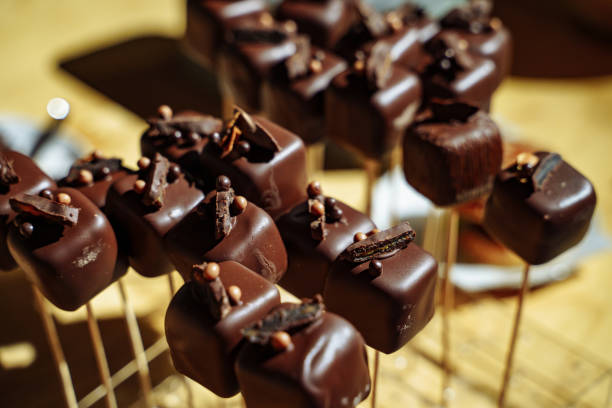 istock Chocolate cakes on a stick at a party. 1139652057