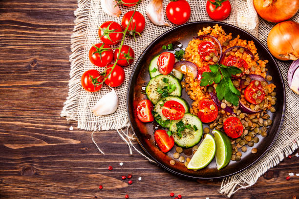 istock Groats and vegetables on wooden table 1139652708