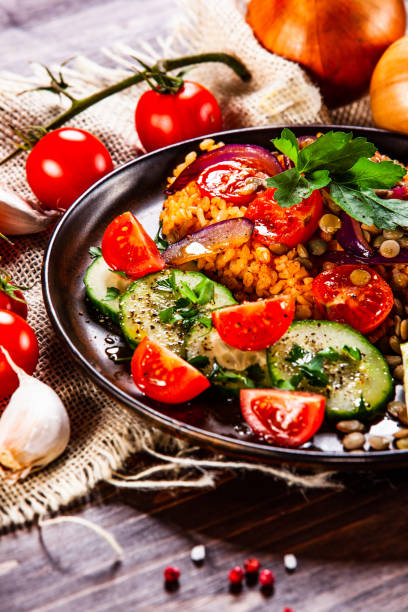 istock Groats and vegetables on wooden table 1139652789