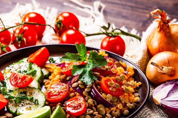 istock Groats and vegetables on wooden table 1139652887