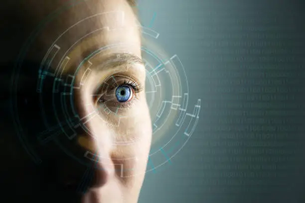 Photo of High Technologies in the future. Young woman's eye and high-tech concept, augmented reality display, wearable computing