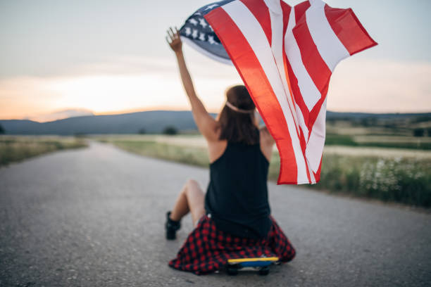istock Woman skater with US flag 1139654934