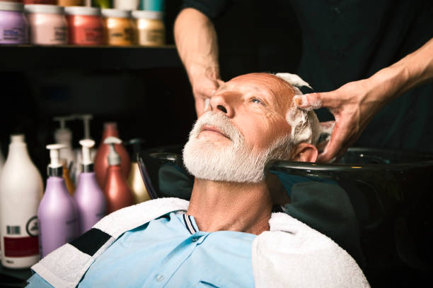 istock Senior man washing his hair 1139656612