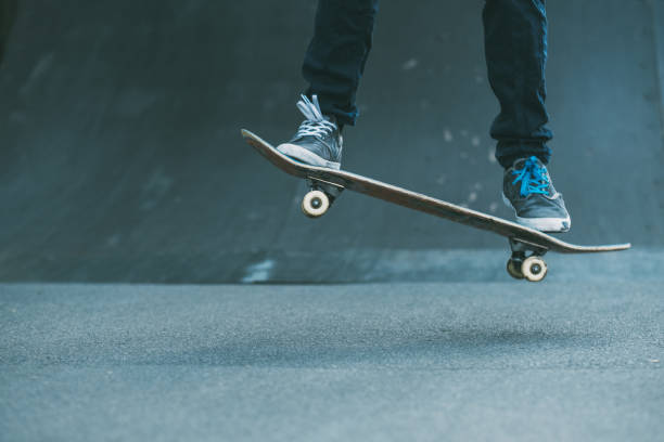 urban man hobby skateboarding leisure trick park Urban man hobby. Skateboarding leisure and practice. Guy performing trick. Skate park ramp. Action shot. Copy space. Ollie stock pictures, royalty-free photos & images