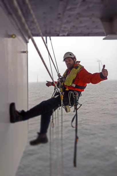 istock Thumb up - Positive Manual high worker offshore rappel on offshore platform with ropers 1139657479