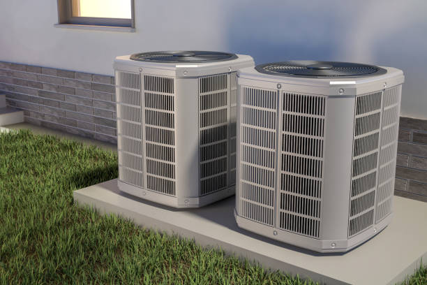 two heat pumps next to the house